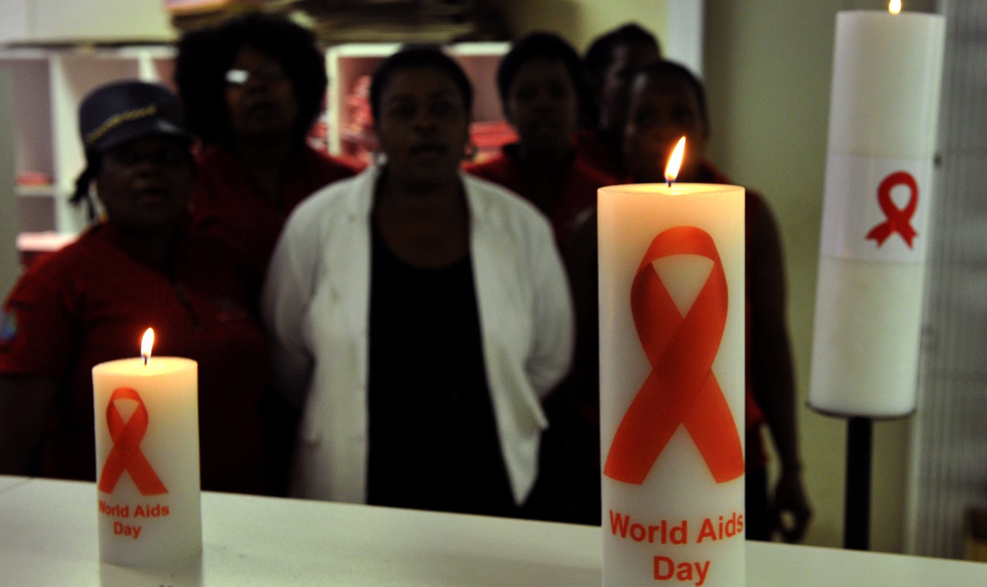 Staff members of the Themba Lethu Clinic in Johannesburg pose with candles commemorating World Aids Day.